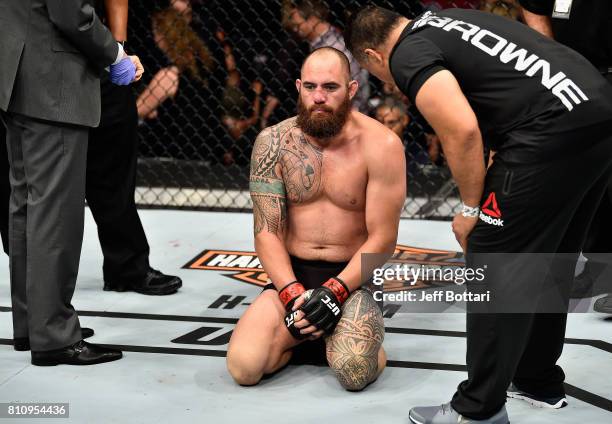 Travis Browne reacts to his submission loss to Aleksei Oleinik of Russia in their heavyweight bout during the UFC 213 event at T-Mobile Arena on July...