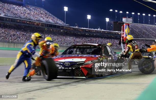 Kyle Busch, driver of the Snickers Toyota, pits during the Monster Energy NASCAR Cup Series Quaker State 400 presented by Advance Auto Parts at...