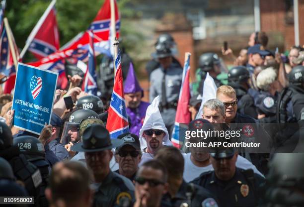 Members of the Ku Klux Klan arrive for a rally, calling for the protection of Southern Confederate monuments, in Charlottesville, Virginia on July 8,...