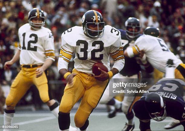 Pittsburgh Steeler Hall of Fame running back Franco Harris on a run through in a 16-6 win over the Minnesota Vikings in Super Bowl IX on January 12,...