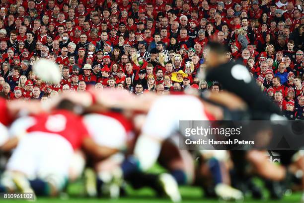 Lions fans look on as a scrum packs down during the Test match between the New Zealand All Blacks and the British & Irish Lions at Eden Park on July...