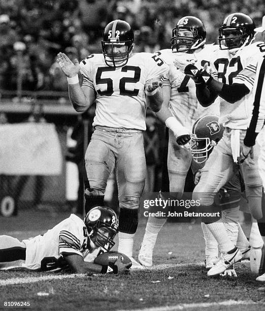 Pittsburgh Steelers wide receiver Louis Lipps scores on a 10-yard touchdown pass with center Mike Webster and wide receiver John Stallworth , both...