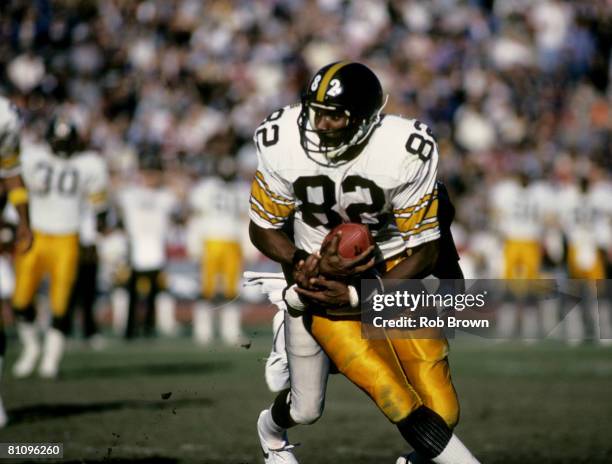 Pittsburgh Steelers wide receiver John Stallworth , inducted into the Pro Football Hall of Fame class of 2002, catches a pass during a game in 1984.