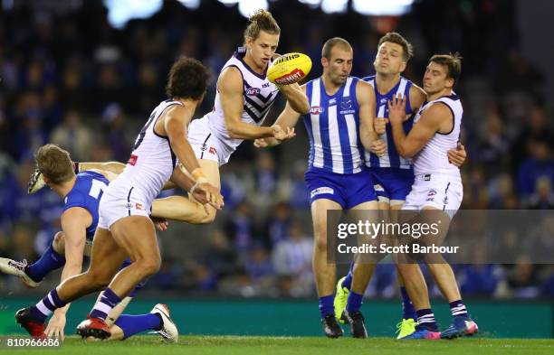 Nat Fyfe of the Dockers passes the ball during the round 16 AFL match between the North Melbourne Kangaroos and the Fremantle Dockers at Etihad...