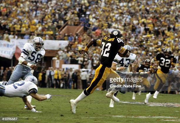 Pittsburgh Steelers Hall of Fame wide receiver John Stallworth streaks down the field on a 75-yard touchdown pass during Super Bowl XIII, a 35-31...