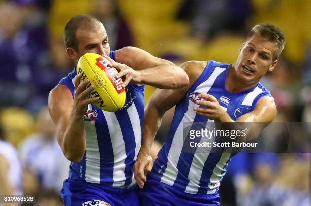 Ben Cunnington of the Kangaroos and Andrew Swallow of the Kangaroos compete for the ball during the round 16 AFL match between the North Melbourne...