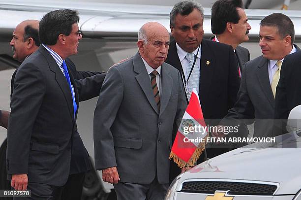 Peruvian Minister of Production Rafael Rey guides Cuban First Vice President Jose Ramon Machado Ventura and Foreign Minister Felipe Perez Roque to an...