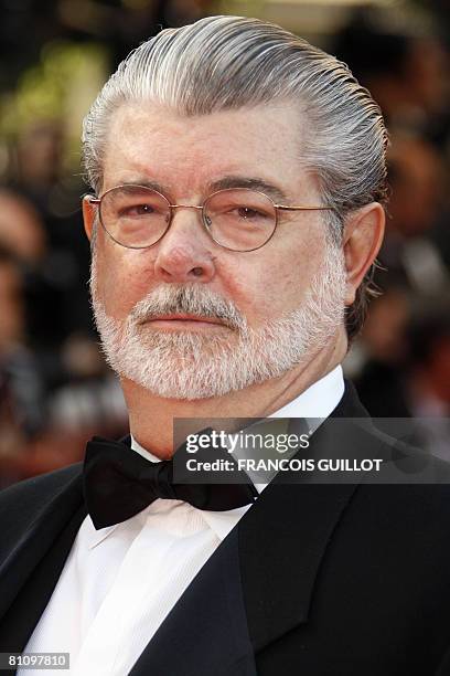 Director and producer George Lucas poses as he arrives to attend the screening of US directors John Stevenson and Mark Osborne's animated film 'Kung...
