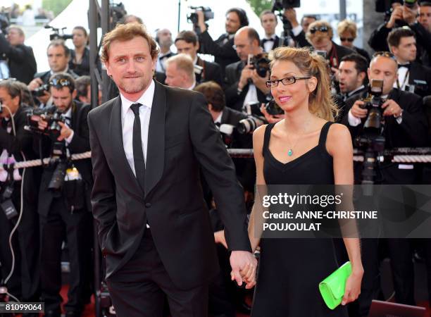 French actor Jean-Paul Rouve and French writer Benedicte Martin arrive to attend the screening of US directors John Stevenson and Mark Osborne's...