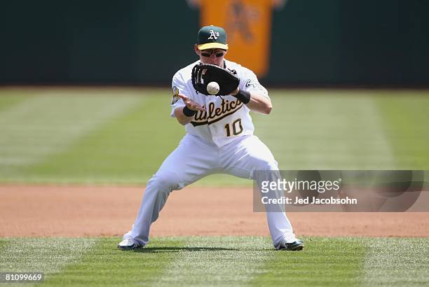 Daric Barton of the Oakland Athletics plays the ball against the Baltimore Orioles during a MLB game on May 7, 2008 at McAfee Coliseum in Oakland,...
