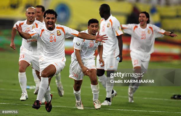 Qatari Umm Salal club players celebrate after winning the final match against al-Gharrafa club, of the Emir Cup football tournament between...