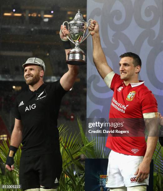 Sam Warburton, the Lions captain, lifts the trophy with Kieran Read, the All Black captain after their sides draw the final test 15-15 and tie the...