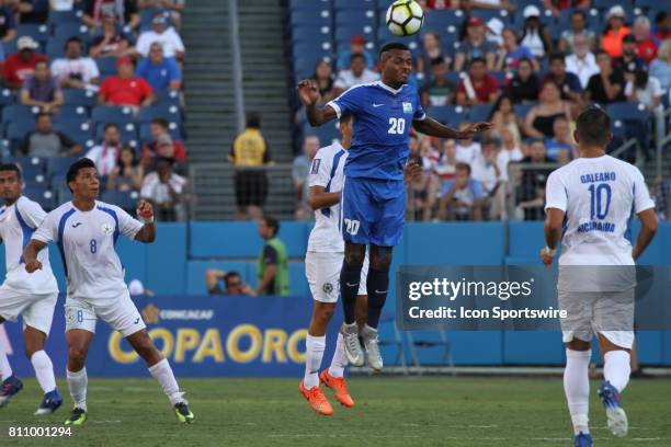 Martinique midfielder Stephane Abaul wins a header at midfieldl during the second half of the CONCACAF Gold Cup Group B match played at Nissan...