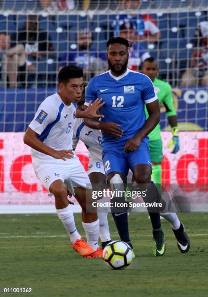 Martinique forward Yoann Arquin and Nicaragua Erick Tellez fight for a loose ball during the CONCACAF Gold Cup Group B match on July 08, 2017 played...