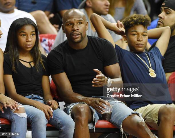 Boxer Floyd Mayweather Jr. , his daughter Jirah Mayweather and his son Koraun Mayweather attend a 2017 Summer League game between the Boston Celtics...