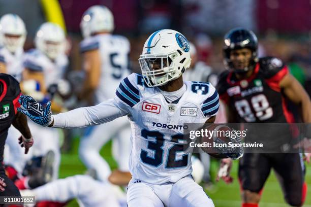 Toronto Argonauts running back James Wilder prepares to stiff arm a defender during Canadian Football League action between the Toronto Argonauts and...