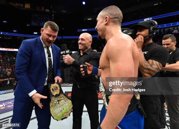 Middleweight champion Michael Bisping challenges newly crowned interim UFC middleweight champion Robert Whittaker of New Zealand after his victory...