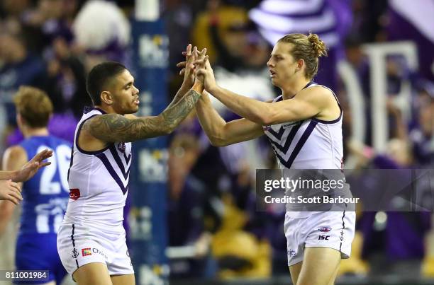 Nat Fyfe of the Dockers is congratulated by Michael Walters of the Dockers after kicking a goal during the round 16 AFL match between the North...