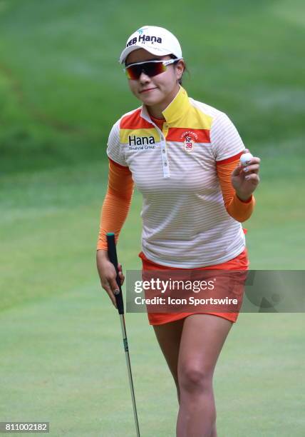 Hee Young Park, Republic of Korea, reacts, and acknowledges the crowd, after sinking a putt on hole number seventeen during the third round of the...