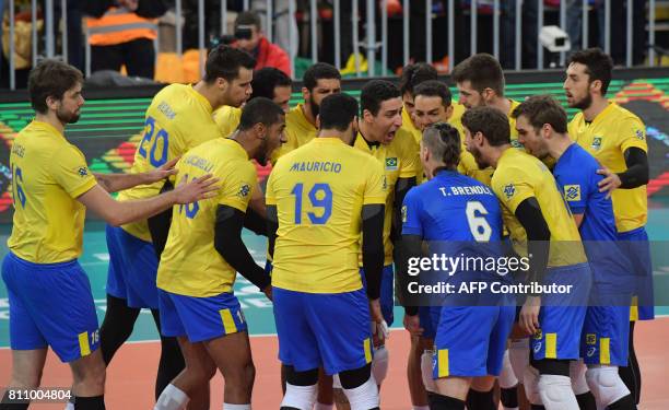 Brazil's players are seen before their World League 2017 volleyball final match between Brazil and France in Curitiba, Brazil on July 08, 2017. / AFP...
