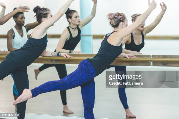 multi-ethnic group of women doing barre workout - leg waxing stock pictures, royalty-free photos & images