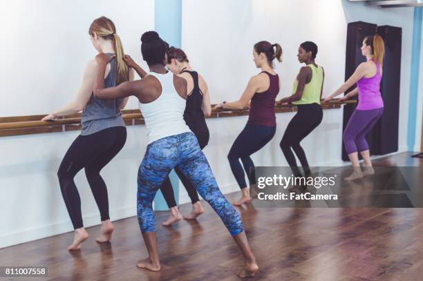 multi-ethnic group of women doing barre workout - hesitant to dance stock pictures, royalty-free photos & images
