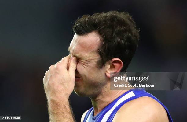 Todd Goldstein of the Kangaroos reacts after missing a shot at goal in the the final minute during the round 16 AFL match between the North Melbourne...