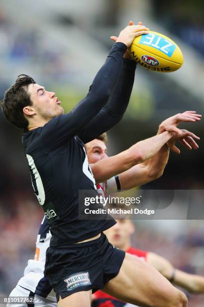 Lachie Plowman of the Blues marks the ball during the round 16 AFL match between the Carlton Blues and the Melbourne Demons at Melbourne Cricket...