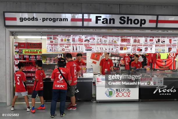 Urawa Red Diamonds supporters check the official marchandise shop prior to the J.League J1 match between Urawa Red Diamonds and Albirex Niigata at...
