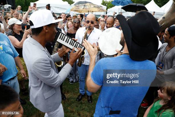 Jon Batiste & Stay Human lead a second line through the crowd during the 2017 Louis Armstrong's Wonderful World Festival at Flushing Meadows Corona...