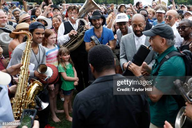 Jon Batiste & Stay Human lead a second line through the crowd during the 2017 Louis Armstrong's Wonderful World Festival at Flushing Meadows Corona...