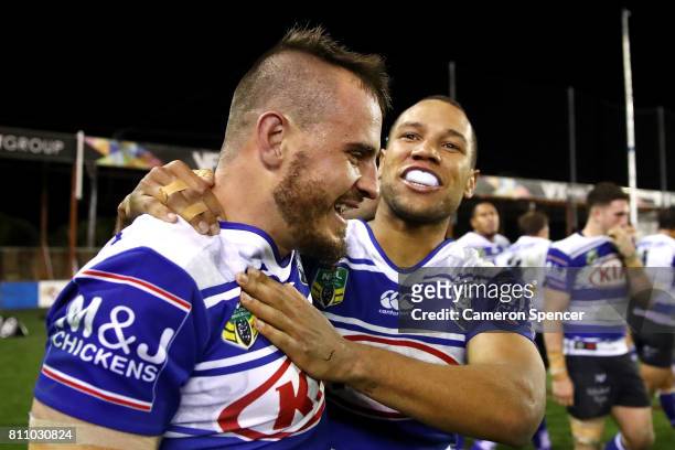 Josh Reynolds of the Bulldogs embraces team mate Moses Mbye of the Bulldogs after scoring the winning try during the round 18 NRL match between the...