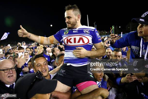 Josh Reynolds of the Bulldogs is chaird off the field after winning the round 18 NRL match between the Canterbury Bulldogs and the Newcastle Knights...