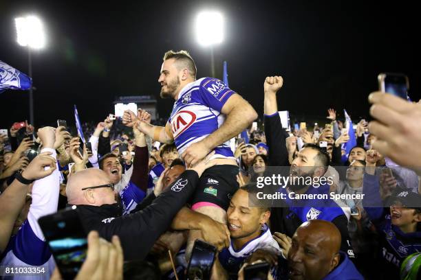 Josh Reynolds of the Bulldogs is chaird off the field after winning the round 18 NRL match between the Canterbury Bulldogs and the Newcastle Knights...