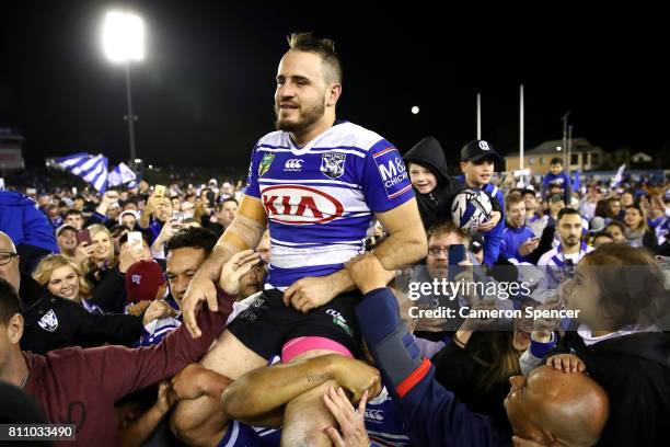 Josh Reynolds of the Bulldogs is chaird off the field after winning the round 18 NRL match between the Canterbury Bulldogs and the Newcastle Knights...