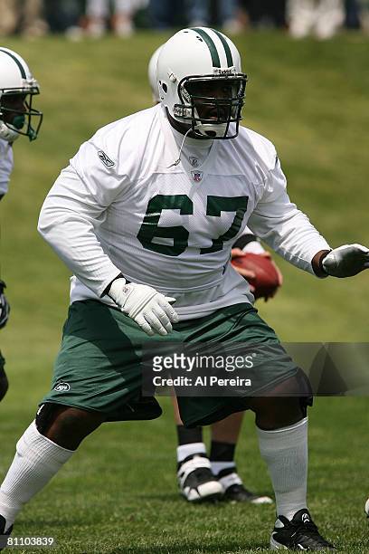 Offensive Lineman Damian Woody of the New York Jets blocks during Organized Team Activities at the team's facilities May 15, 2008 in Hempstead, New...