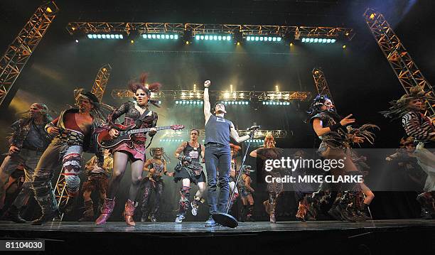 Performers take part in a preview of the hit London show 'We Will Rock You' in Hong Kong on May 16, 2008. 'We Will Rock You' will be performing in...