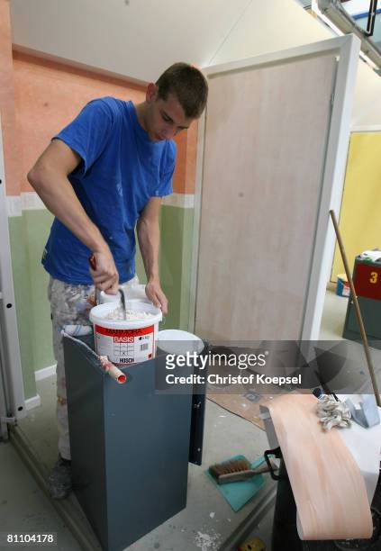 Prisoner learns how to paint a wall at the Iserlohn prison on May 15, 2008 in Iserlohn, Germany. The prison in North Rhine-Westphalia inhabits 292...