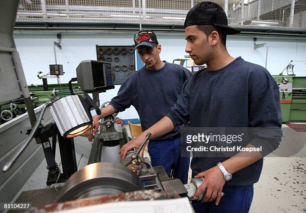 Prisoners Atif and Engin work to be a professional machinist at the Iserlohn prison on May 15, 2008 in Iserlohn, Germany. The prison in North...