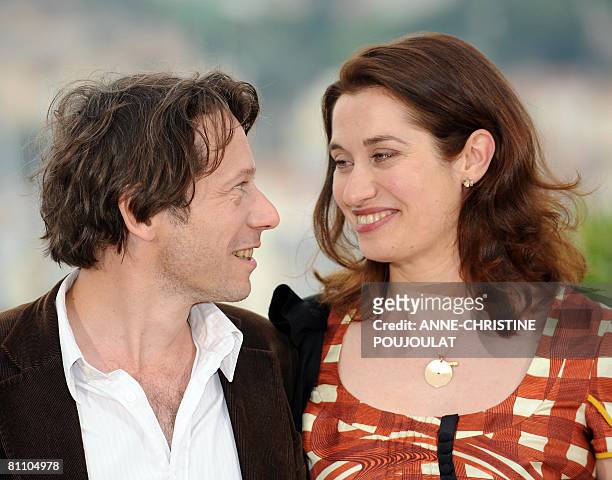 French actors Mathieu Amalric and Emmanuelle Devos pose during a photocall for French director Arnaud Desplechin's film 'A Christmas Tale' at the...