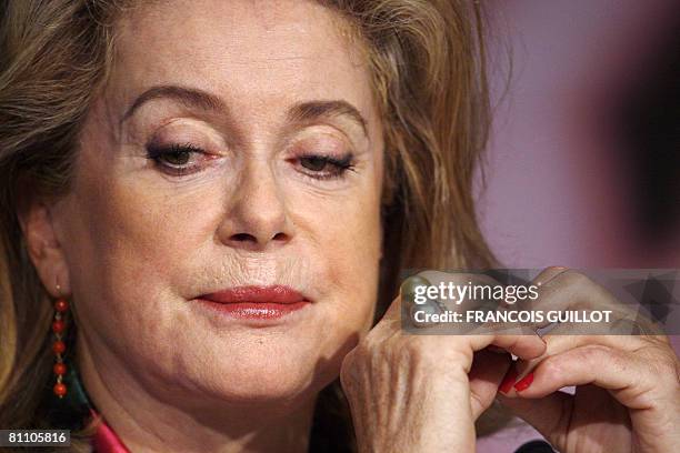 French actresses Catherine Deneuve listens to questions during a press conference after a photocall for her film 'A Christmas Tale' at the 61st...