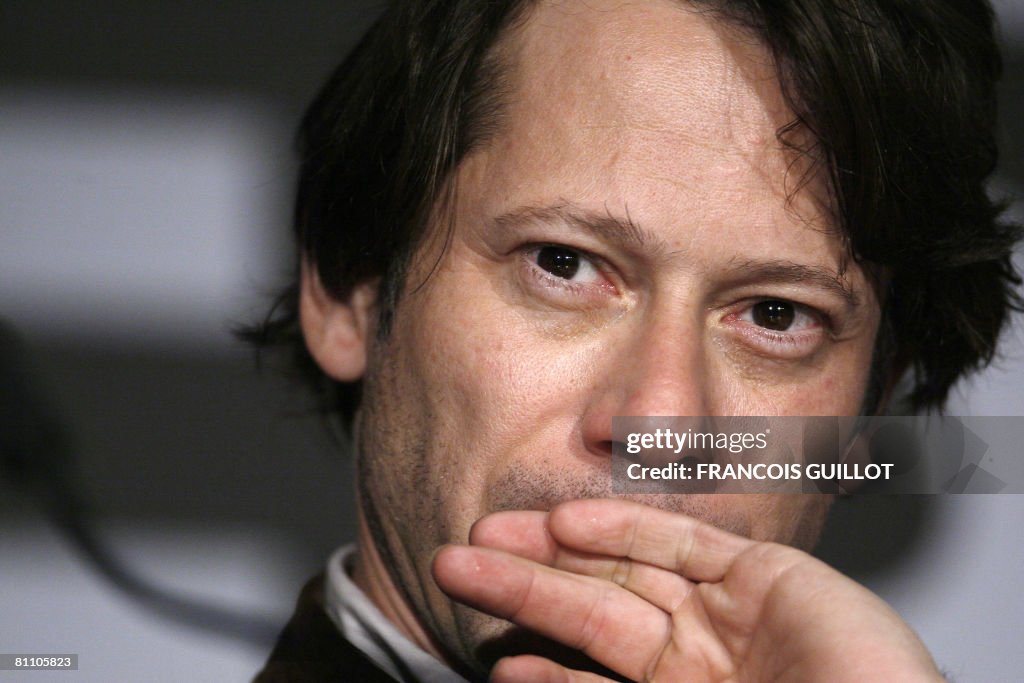 French actor Mathieu Amalric listens to