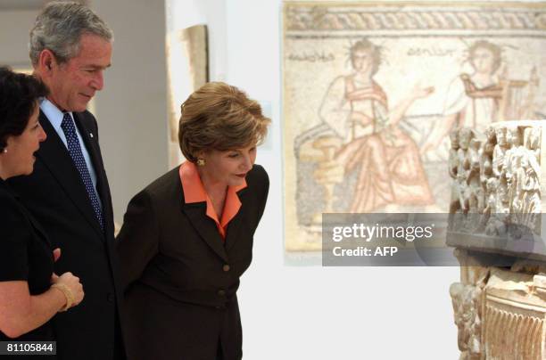 President George W. Bush and First Lady Laura Bush tour the Bible Lands Museum on May 16, 2008 in Jerusalem. Facing dismally low approval ratings at...