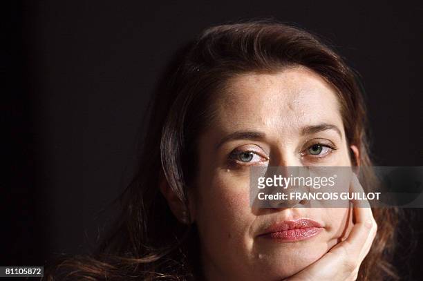 French actress Emmanelle Devos listens to questions during a press conference after a photocall for French director Arnaud Desplechin's film 'A...