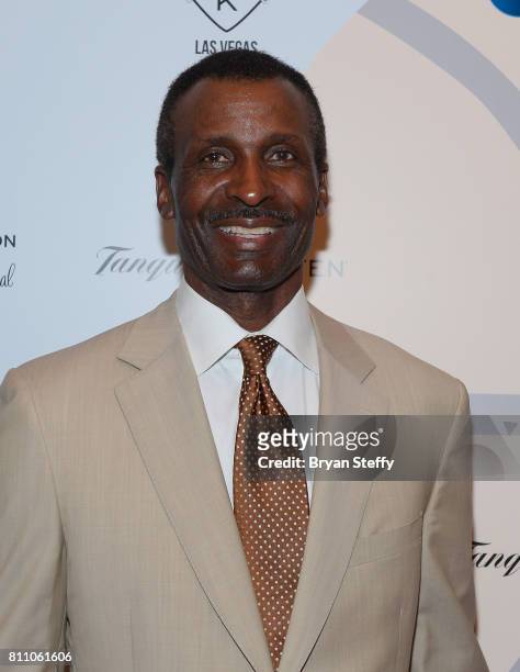 Broadcaster and former professional basketball player Eddie Johnson arrives at the Coach Woodson Las Vegas Invitational red carpet and pairings gala...