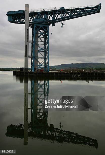 The 150ft Titan crane is reflected on the surface of the River Clyde on May 16, 2008 in Glasgow, Scotland. The world's first giant cantilever crane,...