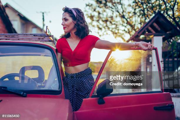 young retro styled woman in vintage car - classic car show stock pictures, royalty-free photos & images