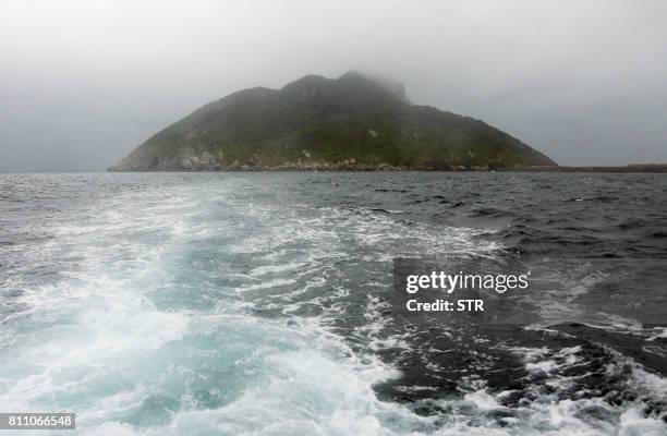 This September 30, 2016 picture shows a view of Okinoshima island, some 60 kilometres from Munakata city, Fukuoka prefecture. - The island of...