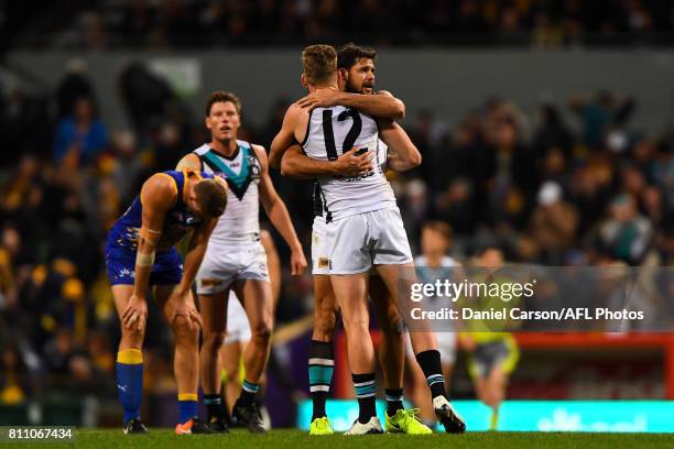 Jackson Trengove and Paddy Ryder of the Power celebrate the win on there final siren during the 2017 AFL round 16 match between the West Coast Eagles...