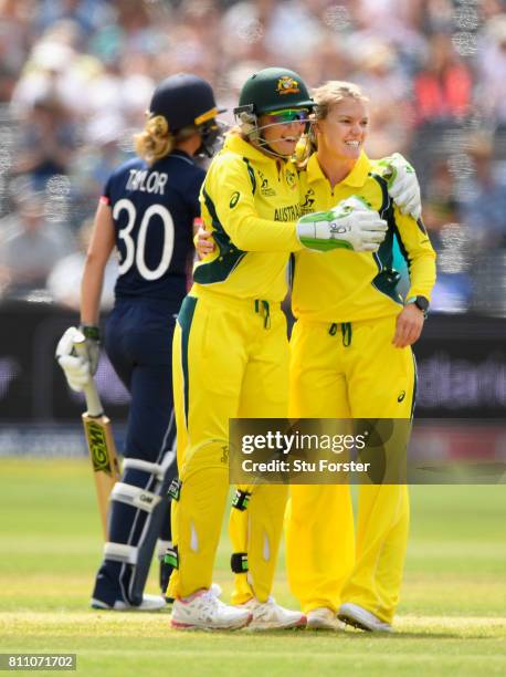 Australia bowler Kristen Beams is congratulated by Healy after bowling Sarah Taylor during the ICC Women's World Cup 2017 match between England and...